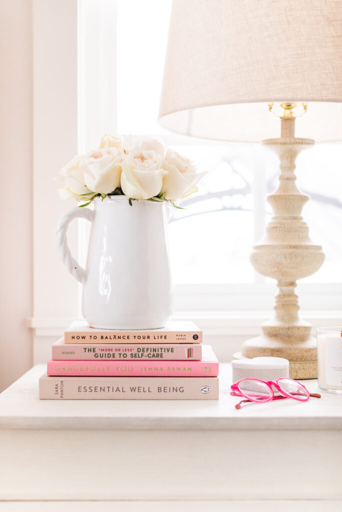 Nightstand with flowers and a lamp; home decor